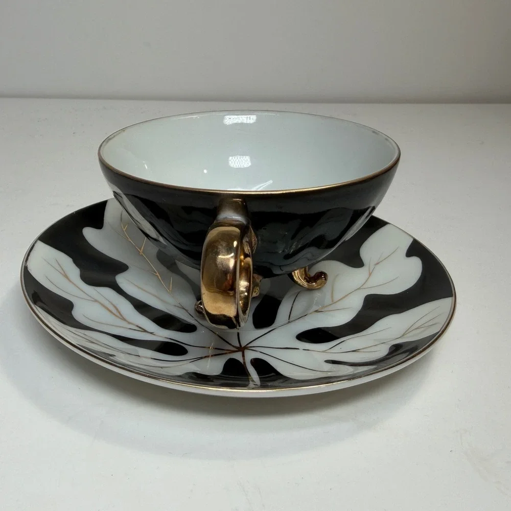 Footed Tea Cup and Saucer Black White Gold Leaf MCM Holywood Regency Art Deco